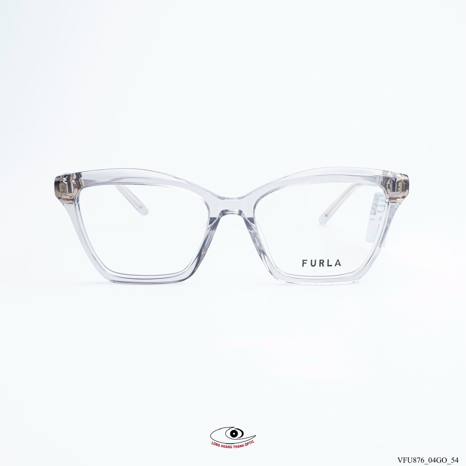 Gọng kính Furla VFU876 Col.04GO dáng mắt mèo trong suốt, thiết kế hiện đại, chất liệu acetate cao cấp, logo vàng đồng tinh tế.