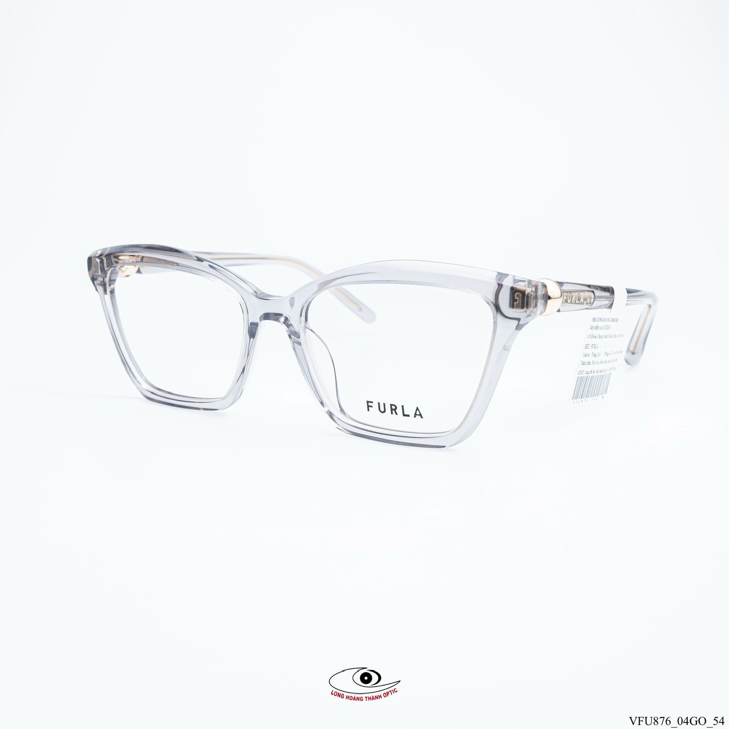 Gọng kính Furla VFU876 Col.04GO dáng mắt mèo trong suốt, thiết kế hiện đại, chất liệu acetate cao cấp, logo vàng đồng tinh tế.
